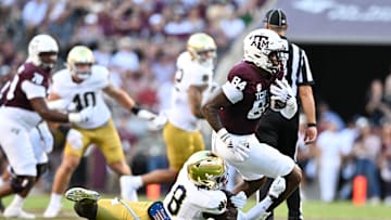 Aug 31, 2024; College Station, Texas, USA; Texas A&M Aggies wide receiver Blake Buntyn (84) runs the ball as Notre Dame Fighting Irish safety Adon Shuler (8) defends during the second quarter at Kyle Field. Mandatory Credit: Maria Lysaker-Imagn Images
