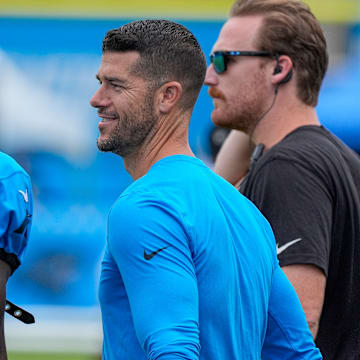 Jul 30, 2024; Charlotte, NC, USA; Carolina Panthers head coach Dave Canales speaks with wide receiver David Moore (83) at Carolina Panthers Practice Fields.