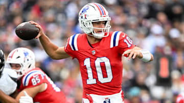 Oct 13, 2024; Foxborough, Massachusetts, USA; New England Patriots quarterback Drake Maye (10) looks to throw against the Houston Texans during the first half at Gillette Stadium. Mandatory Credit: Brian Fluharty-Imagn Images