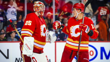 Oct 11, 2023; Calgary, Alberta, CAN; Calgary Flames goaltender Jacob Markstrom (25) and defenseman Nikita Zadorov (16) celebrate win over the Winnipeg Jets at Scotiabank Saddledome. Mandatory Credit: Sergei Belski-USA TODAY Sports