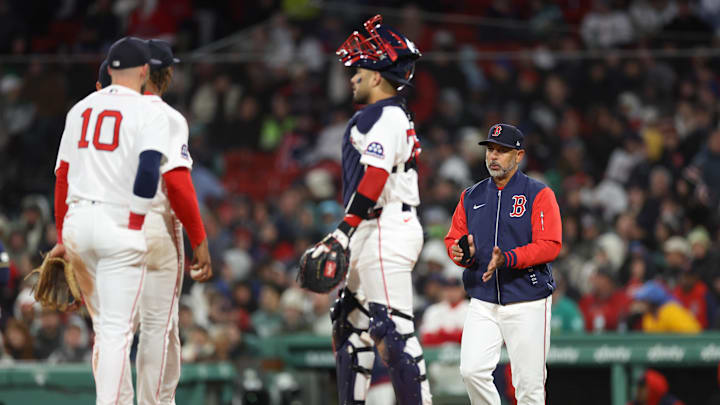 Apr 6, 2026; Boston, Massachusetts, USA; Boston Red Sox manager Alex Cora (13) visits the mound during the fourth inning against the Milwaukee Brewers at Fenway Park. Mandatory Credit: Paul Rutherford-Imagn Images