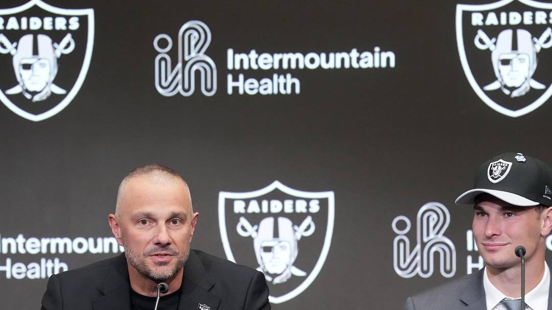 Las Vegas Raiders quarterback Fernando Mendoza (right) and general manager John Spytek (left) at introductory press conference.