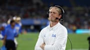 Sep 12, 2025; Pasadena, California, USA;  UCLA Bruins assistant head coach Jerry Neuheisel looks on during the second half against the New Mexico Lobos at Rose Bowl. Mandatory Credit: Kiyoshi Mio-Imagn Images