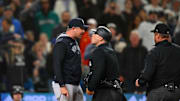 May 13, 2025; Seattle, Washington, USA; New York Yankees manager Aaron Boone argues with umpire Mark Wegner (14) after being ejected during the ninth inning against the Seattle Mariners at T-Mobile Park. 
