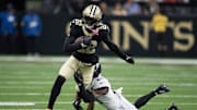 Aug 17, 2025; New Orleans, Louisiana, USA;  New Orleans Saints wide receiver Rashid Shaheed (22) makes a reception against Jacksonville Jaguars cornerback Christian Braswell (21) during the first half against the New Orleans Saints at Caesars Superdome. Mandatory Credit: Matthew Hinton-Imagn Images