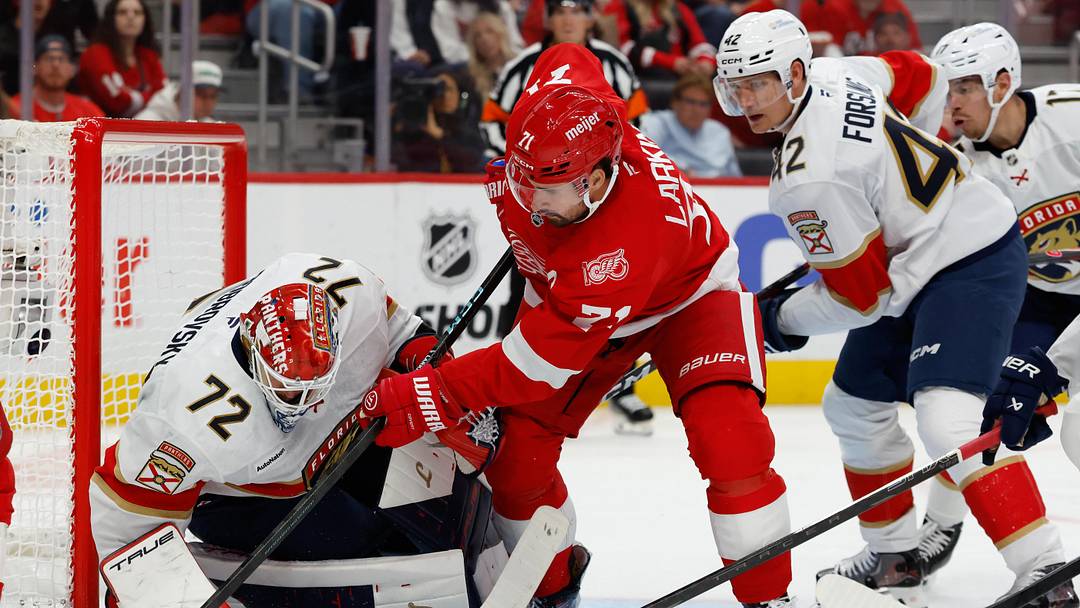 Oct 15, 2025; Detroit, Michigan, USA;  Florida Panthers goaltender Sergei Bobrovsky (72) makes the save on Detroit Red Wings center Dylan Larkin (71) in the second period at Little Caesars Arena. Mandatory Credit: Rick Osentoski-Imagn Images
