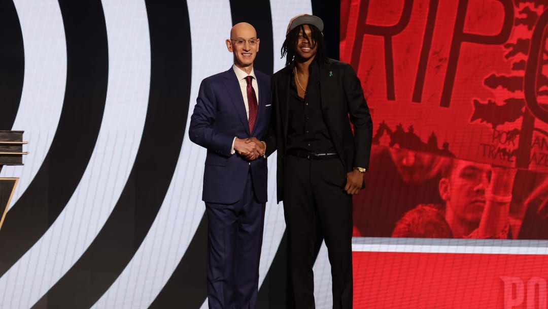 Jun 26, 2024; Brooklyn, NY, USA; Carlton "Bub" Carrington poses for photos with NBA commissioner Adam Silver after being selected in the first round by the Portland Train Blazers in the 2024 NBA Draft at Barclays Center. The former St. Frances Academy star went with the 14th selection of the first round.