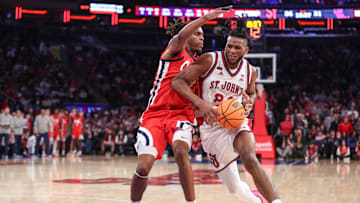 Dec 6, 2025; New York, New York, USA;  St. John's basketball forward Zuby Ejiofor (24) looks to post up against Mississippi Rebels guard Eduardo Klafke (8) in the second half at Madison Square Garden.