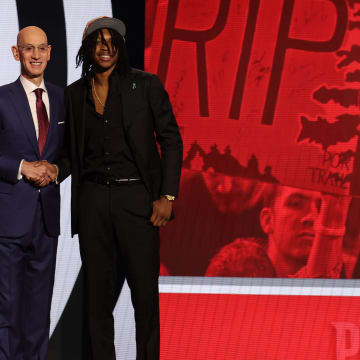 Jun 26, 2024; Brooklyn, NY, USA; Carlton Carrington poses for photos with NBA commissioner Adam Silver after being selected in the first round by the Portland Train Blazers in the 2024 NBA Draft at Barclays Center. Mandatory Credit: Brad Penner-USA TODAY Sports