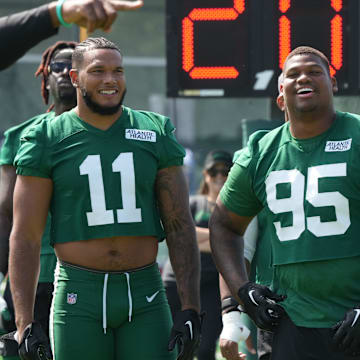 Florham Park, NJ -- July 27, 2024 -- Defensive players, Jermaine Johnson, Quinnen Williams and Levi Fotu get ready for the upcoming season at New York Jets training camp this morning.