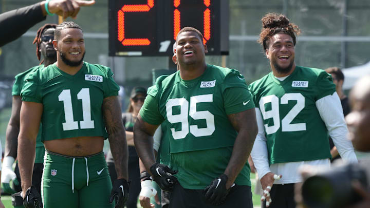 Florham Park, NJ -- July 27, 2024 -- Defensive players, Jermaine Johnson, Quinnen Williams and Levi Fotu get ready for the upcoming season at New York Jets training camp this morning.