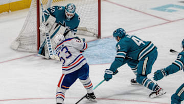 Apr 16, 2025; San Jose, California, USA;  San Jose Sharks goaltender Alexandar Georgiev (40) makes a save against Edmonton Oilers center Jeff Skinner (53) during the third period at SAP Center at San Jose. Mandatory Credit: Neville E. Guard-Imagn Images