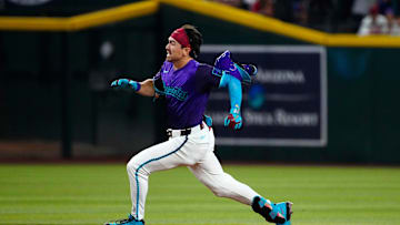 Diamondbacks outfielder Corbin Carroll (7) rounds second on the way to a triple against the Dodgers during a game at Chase Field on May 10, 2025, in Phoenix.