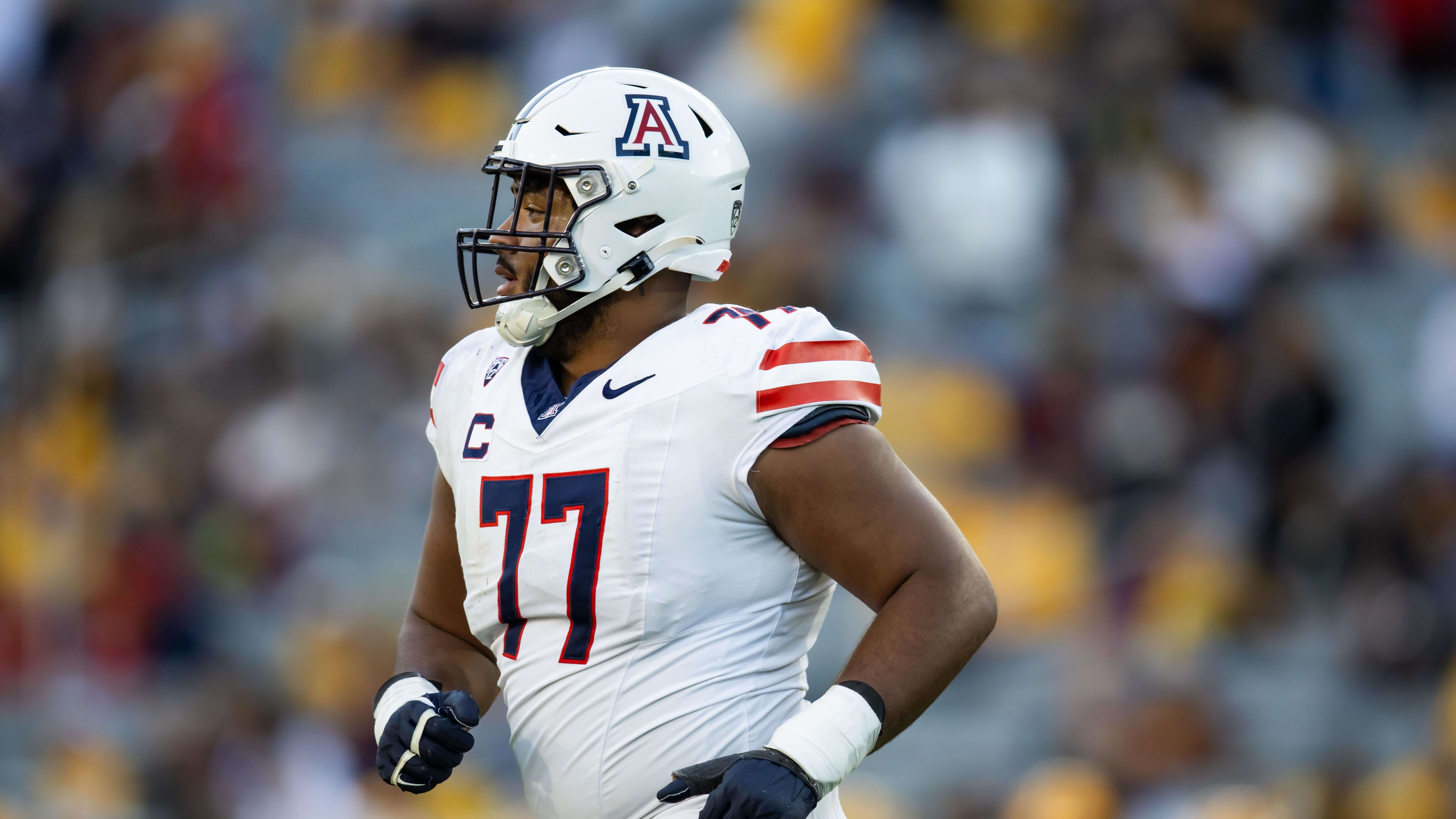 Nov 25, 2023; Tempe, Arizona, USA; Arizona Wildcats offensive lineman Jordan Morgan (77) against the