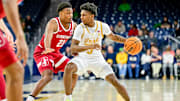 Mar 5, 2025; South Bend, Indiana, USA; Notre Dame Fighting Irish guard Markus Burton (3) dribbles as Stanford Cardinal guard Jaylen Blakes (21) defends in the first half at the Purcell Pavilion. 