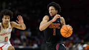 Feb 20, 2025; College Park, Maryland, USA; USC Trojans guard Desmond Claude (1) handles the ball as Maryland Terrapins guard Ja'Kobi Gillespie (0) defends during the first half at Xfinity Center. Mandatory Credit: Reggie Hildred-Imagn Images