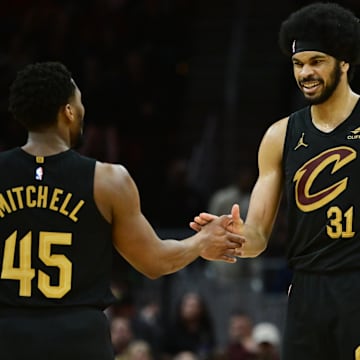 Apr 10, 2024; Cleveland, Ohio, USA; Cleveland Cavaliers guard Donovan Mitchell (45) and center Jarrett Allen (31) celebrate during the second half against the Memphis Grizzlies at Rocket Mortgage FieldHouse. Mandatory Credit: Ken Blaze-Imagn Images