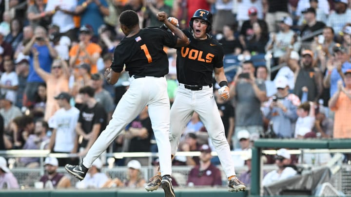 Jun 24, 2024; Omaha, NE, USA;  Tennessee Volunteers left fielder Dylan Dreiling (8) celebrates hitting a home run with second baseman Christian Moore (1) during the seventh inning at Charles Schwab Field Omaha. Mandatory Credit: Steven Branscombe-USA TODAY Sports