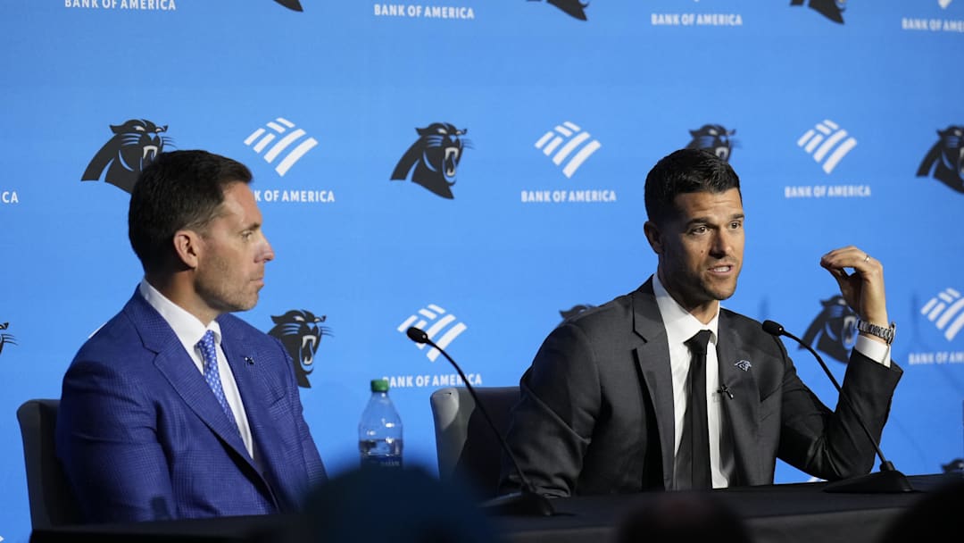Feb 1, 2024; Charlotte, NC, USA;  Carolina Panthers head coach Dave Canales speaks to the media as general manager Dan Morgan looks on during the introductory press conference at Bank of America Stadium. Mandatory Credit: Jim Dedmon-Imagn Images