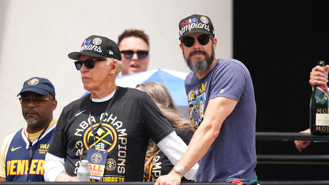 Jun 15, 2023; Denver, CO, USA; Denver Nuggets owner Stan Kroenke (left) and president Josh Kroenke (right) during the championship parade after the Denver Nuggets won the 2023 NBA Finals. Mandatory Credit: Ron Chenoy-Imagn Images