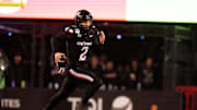 Cincinnati Bearcats quarterback Brendan Sorsby (2) runs for a first down in the fourth quarter of the NCAA football game between the Cincinnati Bearcats and BYU Cougars at Nippert Stadium in Cincinnati on Nov. 22, 2025.