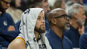 Jan 15, 2025; Minneapolis, Minnesota, USA; Golden State Warriors guard Stephen Curry (30) looks on from the bench against the Minnesota Timberwolves in the second half at Target Center. Mandatory Credit: Jesse Johnson-Imagn Images