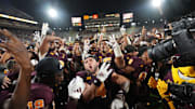 Arizona State running back Cam Skattebo (4) celebrates with his teammates after their 35-31 win against the Kansas Jayhawks at Mountain America Stadium in Tempe on Oct. 5, 2024.