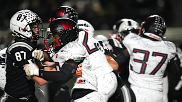 Lakota East Thunderhawks tight end PJ MacFarlane (87) blocks Lakota West Firebirds defensive end Bukari Miles (2) on a punt in the first half of a high school football game between the Lakota West Firebirds and the Lakota East Thunderhawks, Friday, Oct. 6, 2023, at Lakota East High School in Liberty Township, Ohio.