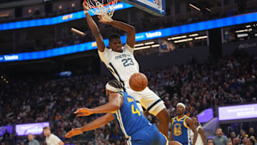Cedric Coward (23) dunks the ball over the top of Golden State Warriors guard Moses Moody (4)