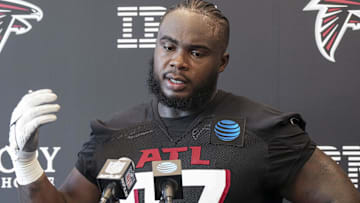 Jul 25, 2024; Buford, GA, USA; Atlanta Falcons defensive end Grady Jarrett (97) talks to the media on the first day of training camp at Falcons Training Camp. Mandatory Credit: Dale Zanine-Imagn Images