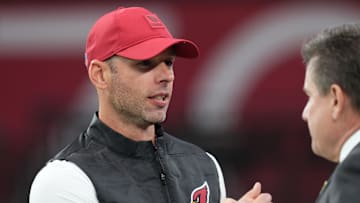 Arizona Cardinals head coach Jonathan Gannon embraces team owner Michael Bidwill before the team plays the Jacksonville Jaguars at State Farm Stadium on Nov. 23, 2025.