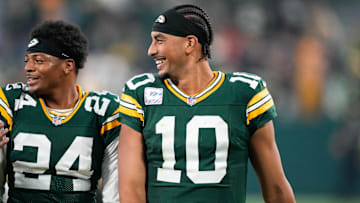 Green Bay Packers quarterback Jordan Love (10) reacts with cornerback Carrington Valentine (24) after the game against the Cincinnati Bengals at Lambeau Field.