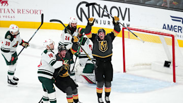 Jan 12, 2025; Las Vegas, Nevada, USA; Vegas Golden Knights left wing Pavel Dorofeyev (16) and Vegas Golden Knights right wing Victor Olofsson (95) celebrate after Vegas Golden Knights center Tomas Hertl (48) scored a goal against the Minnesota Wild during the third period at T-Mobile Arena. Mandatory Credit: Stephen R. Sylvanie-Imagn Images