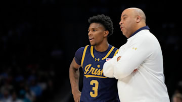 Mar 12, 2025; Charlotte, NC, USA; Notre Dame Fighting Irish guard Markus Burton (3) with head coach Micah Shrewsberry in the first half at Spectrum Center. Mandatory Credit: Bob Donnan-Imagn Images