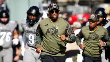 Nov 11, 2023; Boulder, Colorado, USA; Colorado Buffaloes head coach Deion Sanders runs on to the field before the first half against the Arizona Wildcats at Folsom Field. Mandatory Credit: Ron Chenoy-Imagn Images