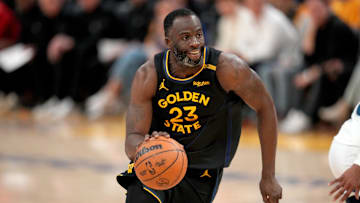 Golden State Warriors' Draymond Green dribbles the ball against the Minnesota Timberwolves during the 2025 NBA Playoffs.