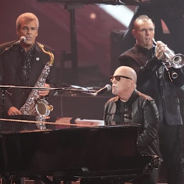 Billy Joel performs  at the 66th annual Grammy Awards. 