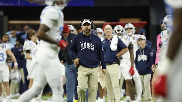 Jan 1, 2026; New Orleans, LA, USA; Mississippi Rebels head coach Pete Golding (center) looks on from the field during a stoppage in play during the second half of the 2026 Sugar Bowl and quarterfinal game of the College Football Playoff against the Georgia Bulldogs at Caesars Superdome. Mandatory Credit: Amber Searls-Imagn Images