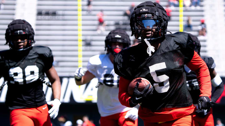 Cincinnati Bearcats safety D.J. Taylor (5) runs a punt and kick off return drill during the University of Cincinnati annual Red and Black Spring football game and practice at Nippert Stadium in Cincinnati on Saturday, April 13, 2024.