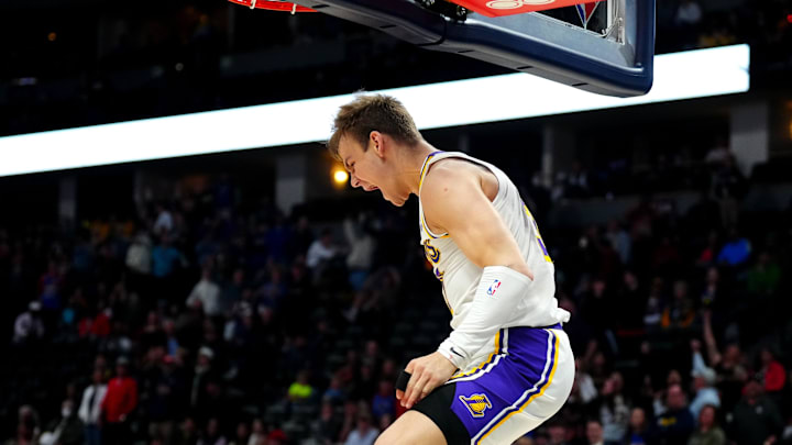 Apr 10, 2022; Denver, Colorado, USA; Los Angeles Lakers guard Mac McClung (37) celebrates the overtime win against the Denver Nuggets at Ball Arena. Mandatory Credit: Ron Chenoy-Imagn Images