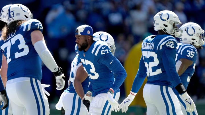 Oct 2, 2022; Indianapolis, Indiana, USA; Indianapolis Colts linebacker Shaquille Leonard (53) gives teammates a five as they run onto the field before a game against the Tennessee Titans at Lucas Oil Stadium. Mandatory Credit: Jenna Watson/IndyStar-USA TODAY NETWORK
