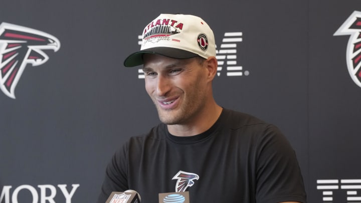 Jul 25, 2024; Buford, GA, USA; Atlanta Falcons quarterback Kirk Cousins (18) talks to the media on the first day of training camp at Falcons Training Camp.