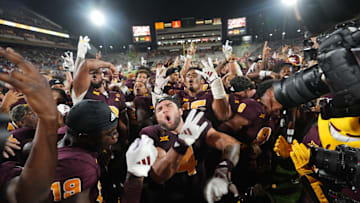 Arizona State running back Cam Skattebo (4) celebrates with his teammates after their 35-31 win against the Kansas Jayhawks at Mountain America Stadium in Tempe on Oct. 5, 2024.