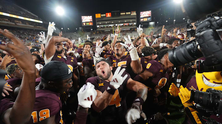 Arizona State running back Cam Skattebo (4) celebrates with his teammates after their 35-31 win against the Kansas Jayhawks at Mountain America Stadium in Tempe on Oct. 5, 2024.