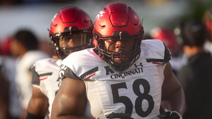 Oct 29, 2022; Orlando, Florida, USA; Cincinnati Bearcats defensive lineman Dontay Corleone (58) jogs off the field after recovering a fumble in the third quarter against the UCF Knights at FBC Mortgage Stadium. UCF won 25-21. Mandatory Credit: Kareem Elgazzar/The Cincinnati Enquirer Sentinel via USA TODAY NETWORK