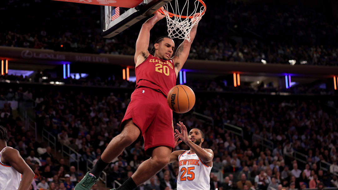 Oct 22, 2025; New York, New York, USA; Cleveland Cavaliers guard Jaylon Tyson (20) hangs on the rim after a dunk against New York Knicks guard Mikal Bridges (25) during the second quarter at Madison Square Garden. Mandatory Credit: Brad Penner-Imagn Images Oct 22, 2025; New York, New York, USA; Cleveland Cavaliers guard Jaylon Tyson (20) hangs on the rim after a dunk against New York Knicks guard Mikal Bridges (25) during the second quarter at Madison Square Garden. Mandatory Credit: Brad Penner-Imagn Images