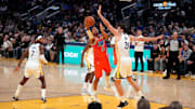 Dec 2, 2025; San Francisco, California, USA; Oklahoma City Thunder forward Aaron Wiggins (21) shoots the ball around the reach of Golden State Warriors center Quinten Post (21) in the third quarter at the Chase Center. Mandatory Credit: Cary Edmondson-Imagn Images