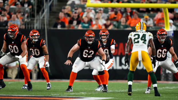 Ex-Husky Jaxson Kirkland (60) is shown blocking in a 2023 Cincinnati Bengals exhibition game against Green Bay.