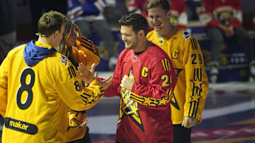 Feb 1, 2024; Toronto, Ontario, CANADA; Team Hughes celebrity captain Michael Buble (24) shakes hands with Colorado Avalanche defenceman Cale Makar (8) as Team MacKinnon captain Nathan MacKinnon (29) looks on during the NHL All-Star Player Draft on NHL All-Star Thursday at Scotiabank Arena. Mandatory Credit: John E. Sokolowski-Imagn Images