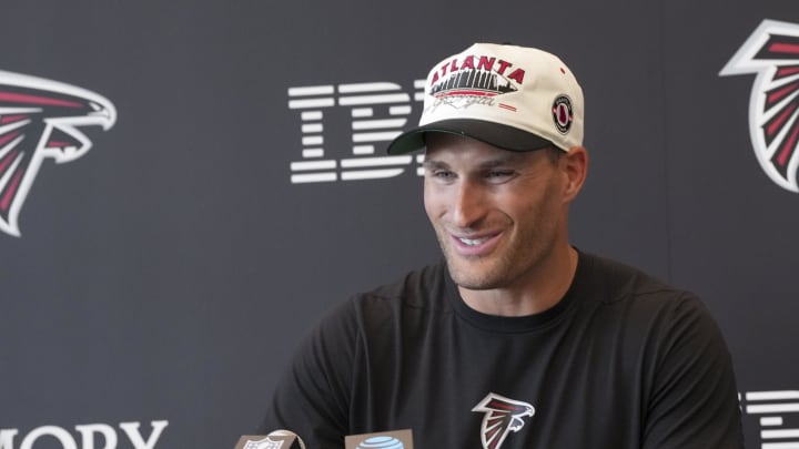 Jul 25, 2024; Buford, GA, USA; Atlanta Falcons quarterback Kirk Cousins (18) talks to the media on the first day of training camp at Falcons Training Camp. Mandatory Credit: Dale Zanine-USA TODAY Sports